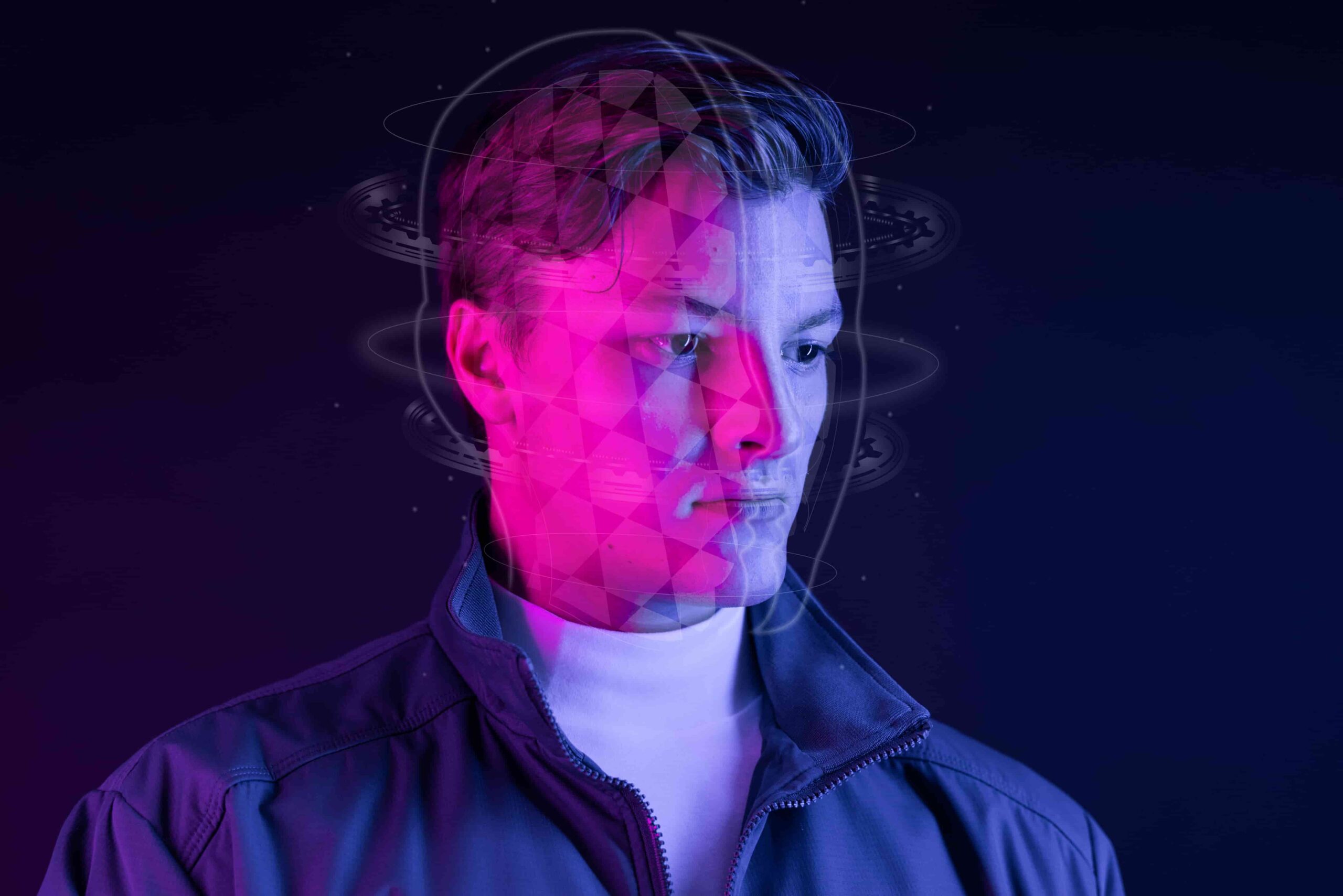 Homem com efeitos gráficos futuristas ao redor da cabeça, ilustrando processos mentais e o que estuda quem faz neurociências.